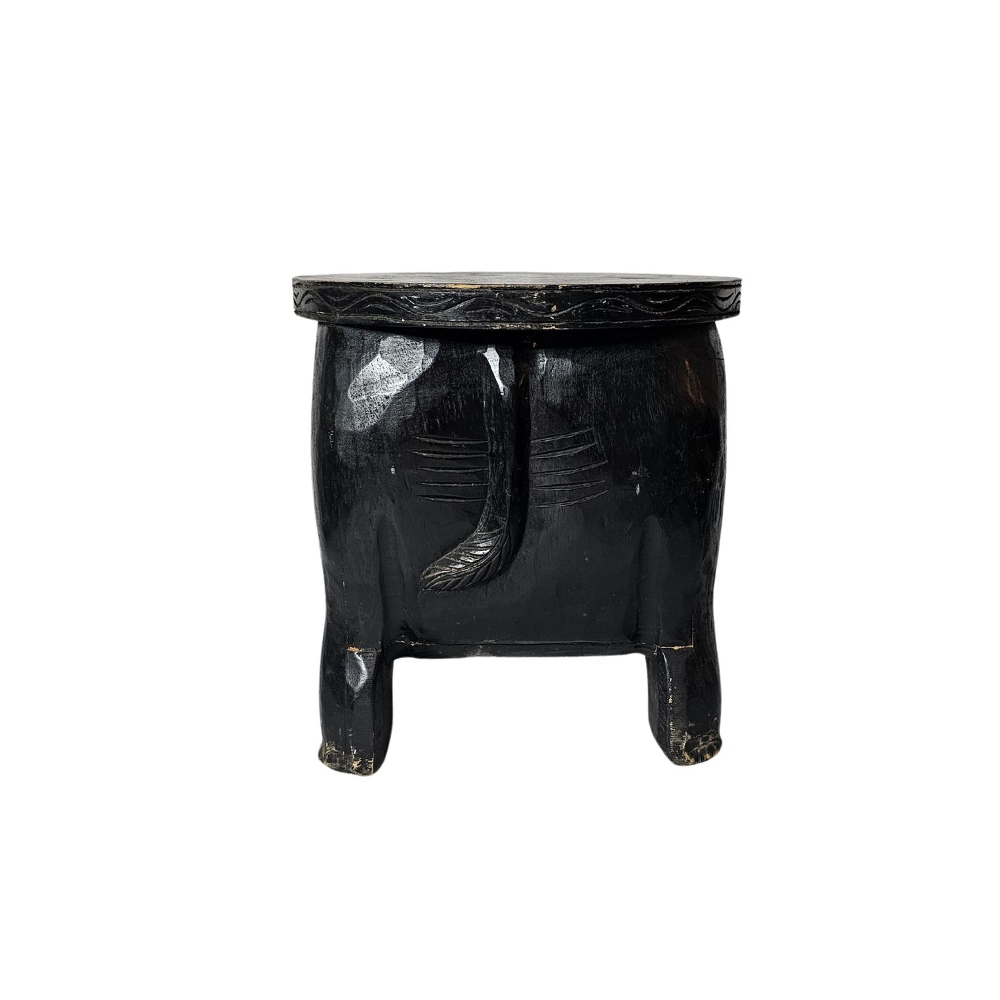 Quirky and fun, this stool features intricate hand-carved details and is stained a deep black.
