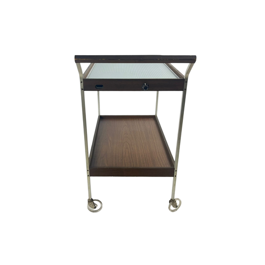 Side view of heated cart with hot glass and wood tray, mid-century modern style SALTON from the 1960s on a white background