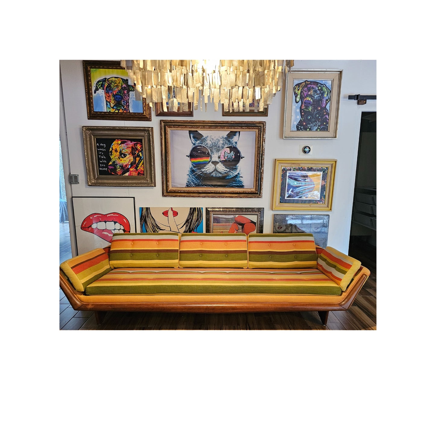 This amazing gondola sofa, crafted by Adrian Pearsall for Craft Associates, features a solid walnut frame and period tweed fabric. The front is adorned with solid walnut accents and the legs are sculpted from walnut. With its angled arms and customized side pillows, this sofa is perfect for reclining and relaxing.