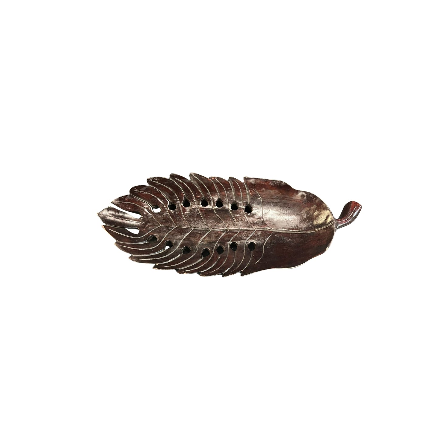 Take a risk and add an organic touch to your home decor with this Philodendron leaf wood carved tray. Made from earthy wood and carved to perfection, this tray is a bold and adventurous addition to any space. Spruce up your home with this unique and natural piece.
Beautifully wood-carved tray in leaf details and mahogany stained, a conversation centerpiece