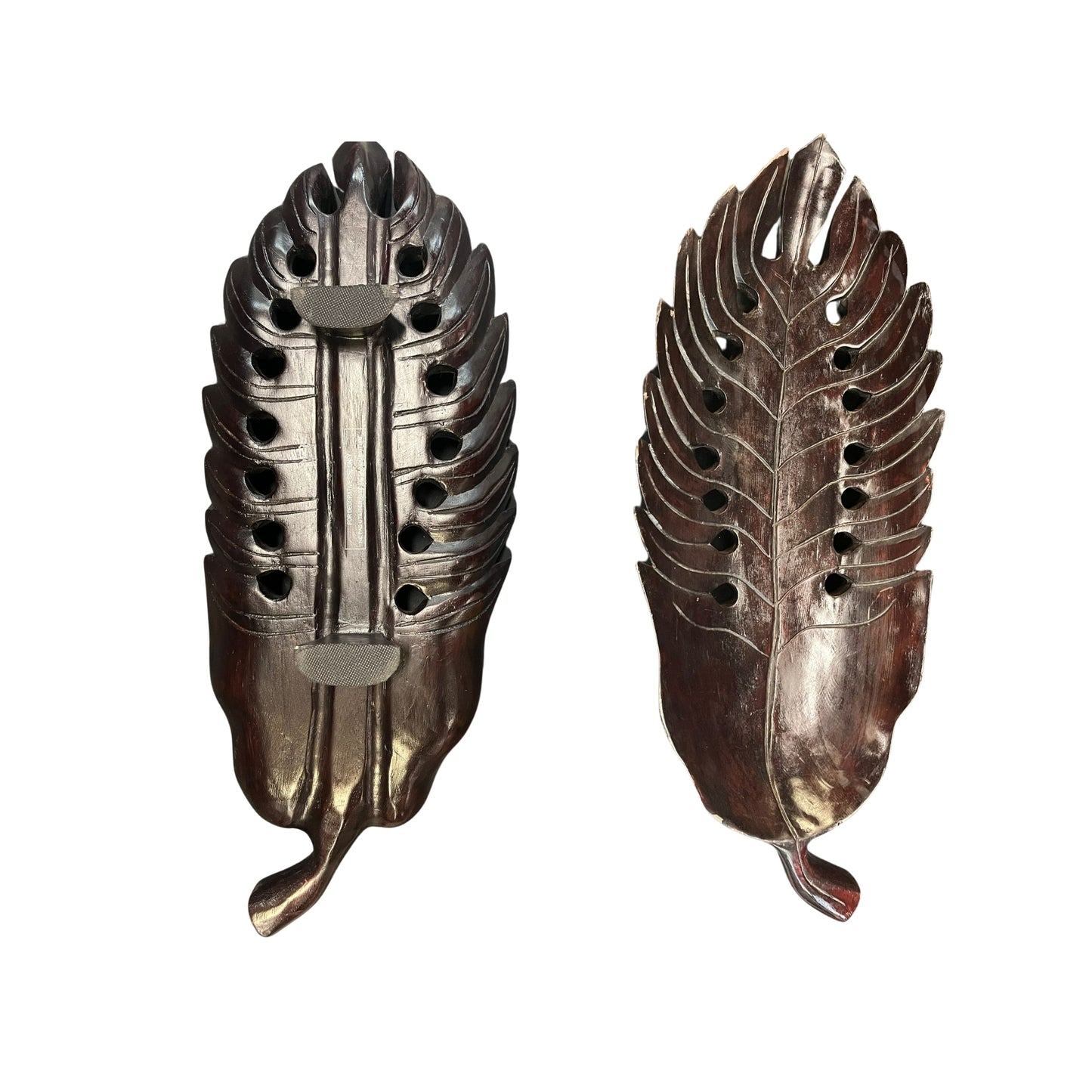 Take a risk and add an organic touch to your home decor with this Philodendron leaf wood carved tray. Made from earthy wood and carved to perfection, this tray is a bold and adventurous addition to any space. Spruce up your home with this unique and natural piece.
Beautifully wood-carved tray in leaf details and mahogany stained, a conversation centerpiece