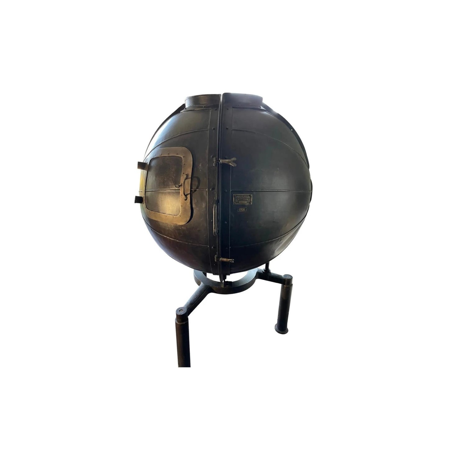 Incorporating the vintage feel of a century-old German lightbulb voltage tester, the "1920's German Light Bulb Voltage Tester Bar" from Restoration Hardware showcases a beautifully restored piece salvaged from a German factory.
Industrial style bar cabinet, opening to shelved interior, fitted with seven bottle wine rack, rising on tripodal base, for use: base drilled at feet and needs to be secured to ground.