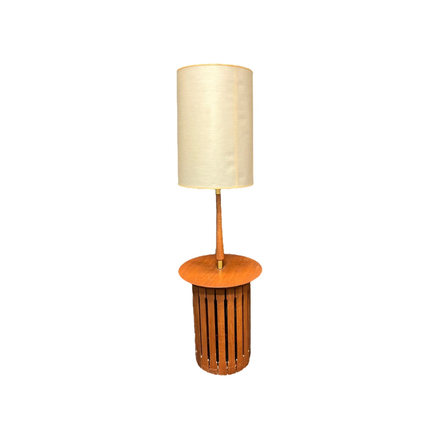 Mid Century Modern Wood Floor Lamp with table! Elevate your living space with this stylish and functional piece. Rare and hard to find, the sleek design features a built-in table perfect for holding books, drinks, or decorative items. With warm and inviting lighting, this lamp is sure to enhance any room.