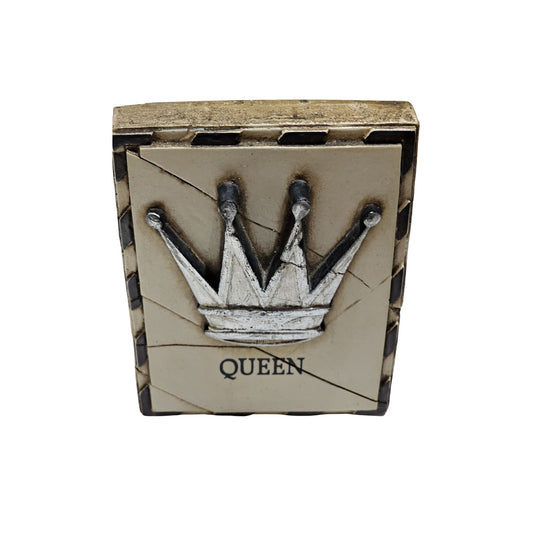 Decorative tile with a crown design and 'QUEEN' text on a white background