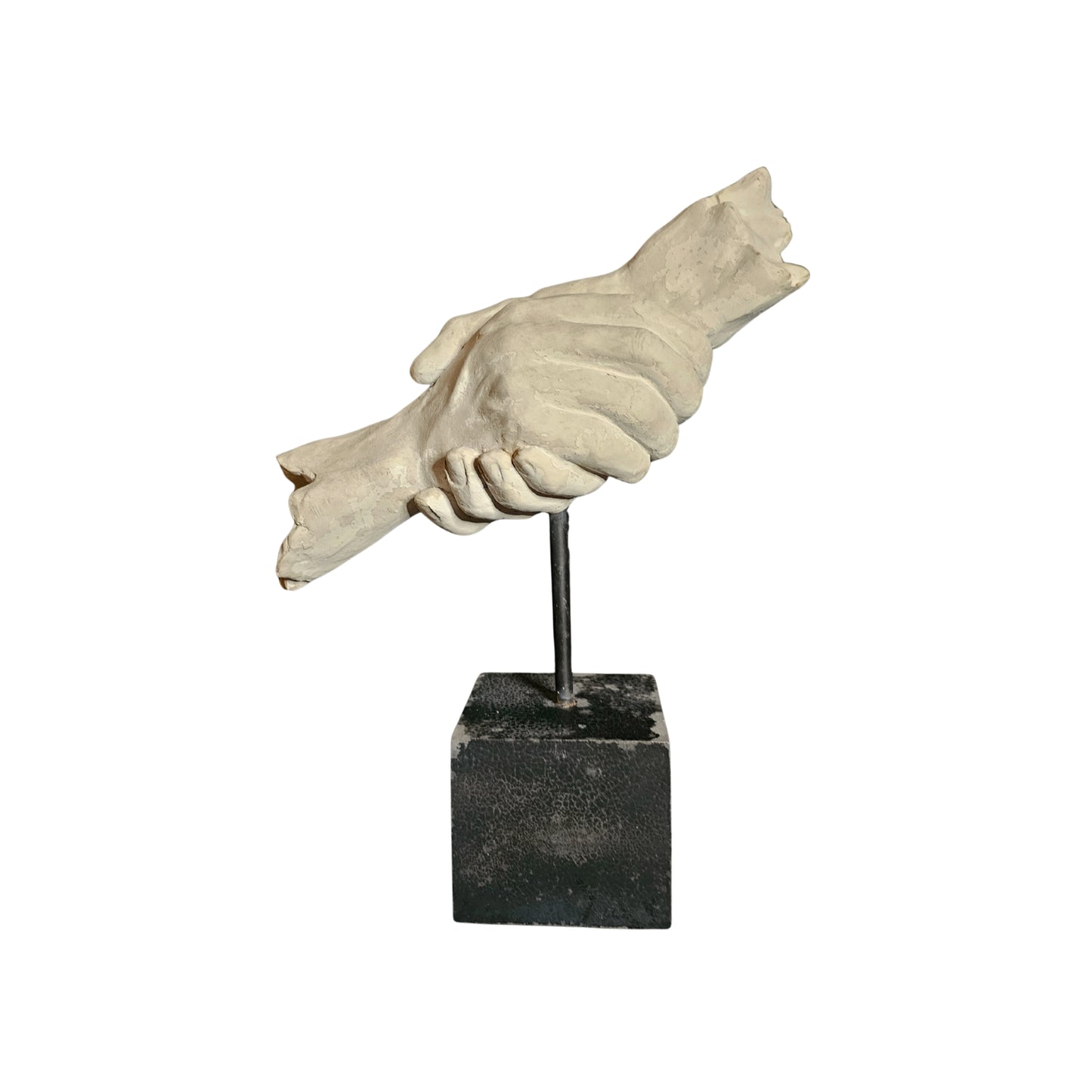 Statue of a hand holding a heart on a black square base against a white background