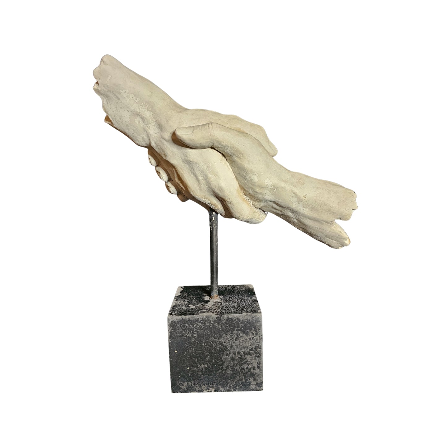 Decorative sculpture of hands on a resin base against a white background
