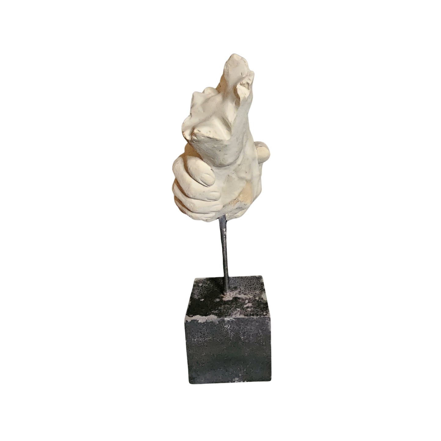 Decorative sculpture on a black square base against a white background