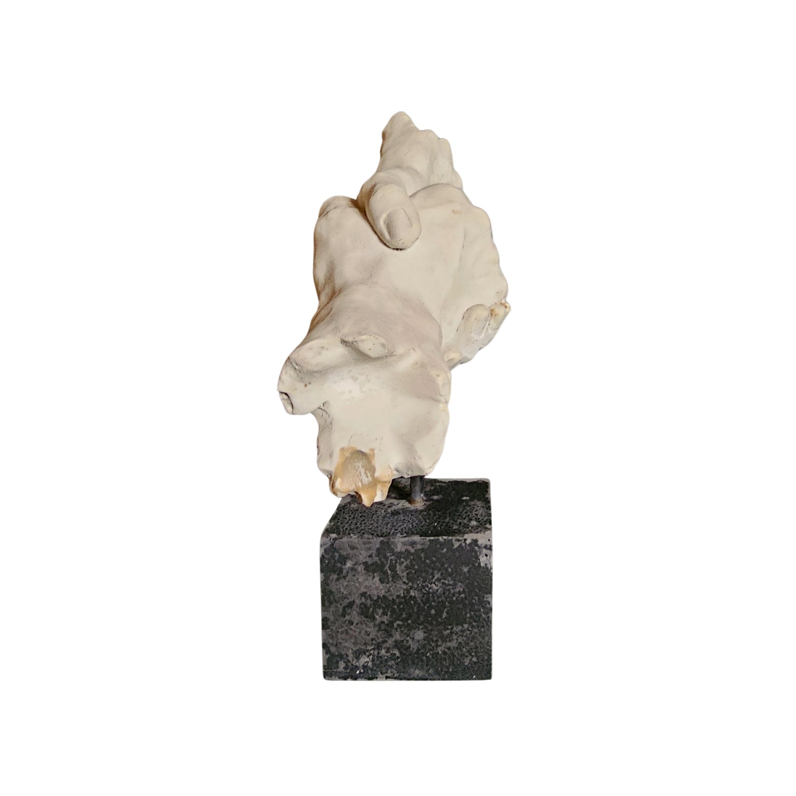 Resin sculpture on a black base against a white background