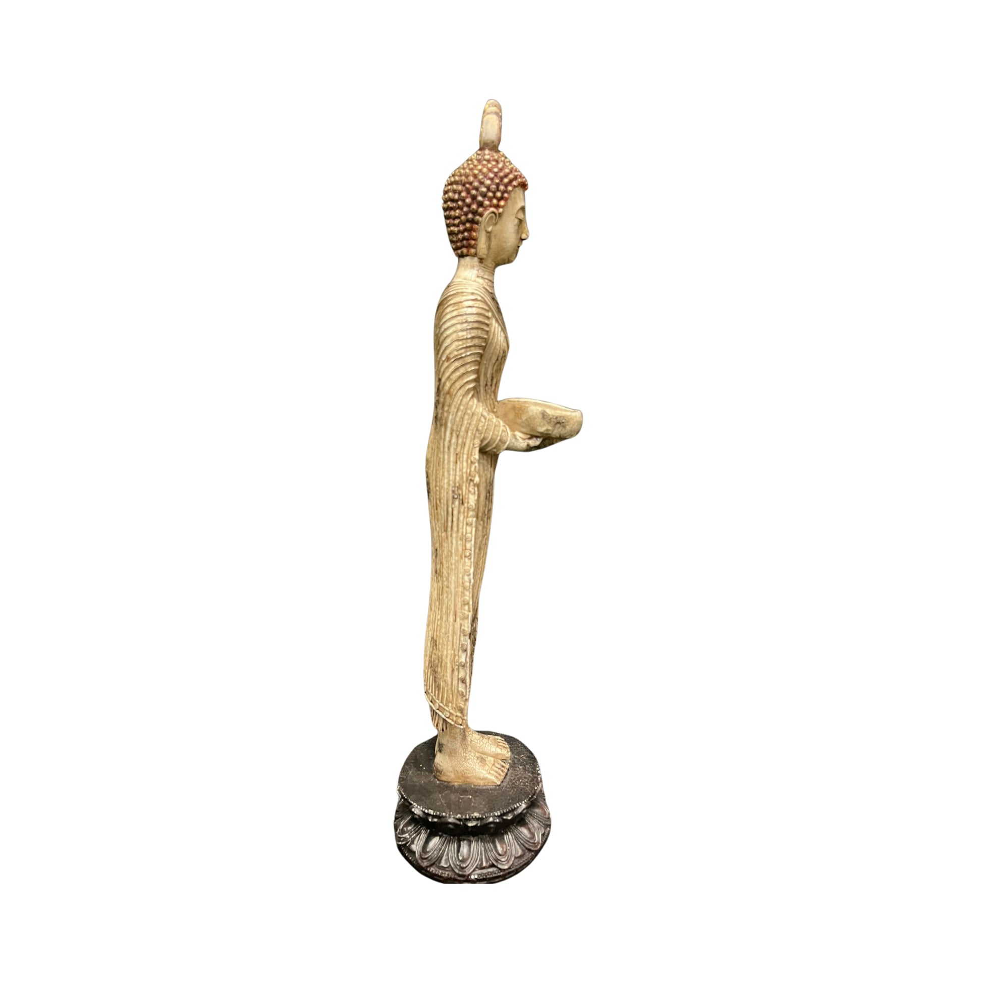 Side view Statue of a standing Buddha on a white background