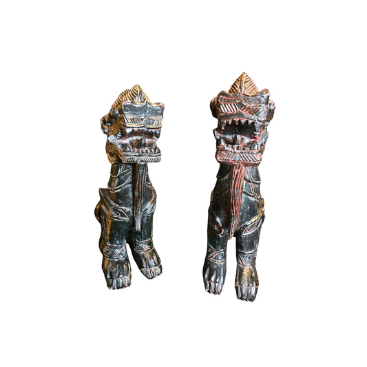 With these antique Chinese wood carved Foo Dogs by your side, you'll never have to worry about evil spirits again! According to Chinese culture, these mythical lions are powerful protectors that bring a sense of safety and peace to your home. Their intricate carvings and sturdy construction only add to their value and beauty. Let these legendary creatures guard your space with their unwavering strength and presence 
