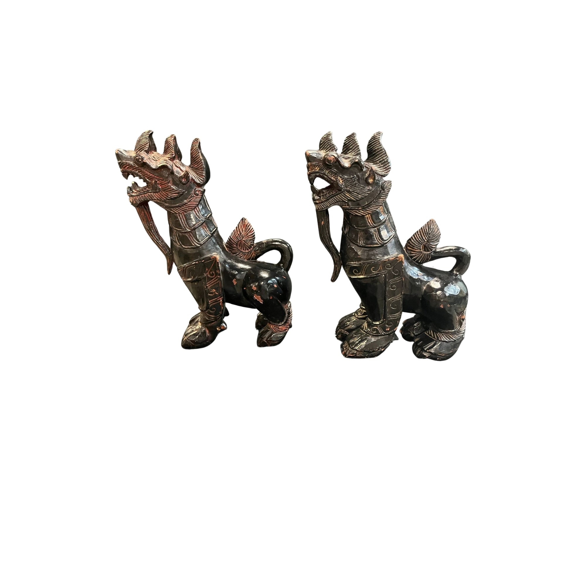 With these antique Chinese wood carved Foo Dogs by your side, you'll never have to worry about evil spirits again! According to Chinese culture, these mythical lions are powerful protectors that bring a sense of safety and peace to your home. Their intricate carvings and sturdy construction only add to their value and beauty. Let these legendary creatures guard your space with their unwavering strength and presence 