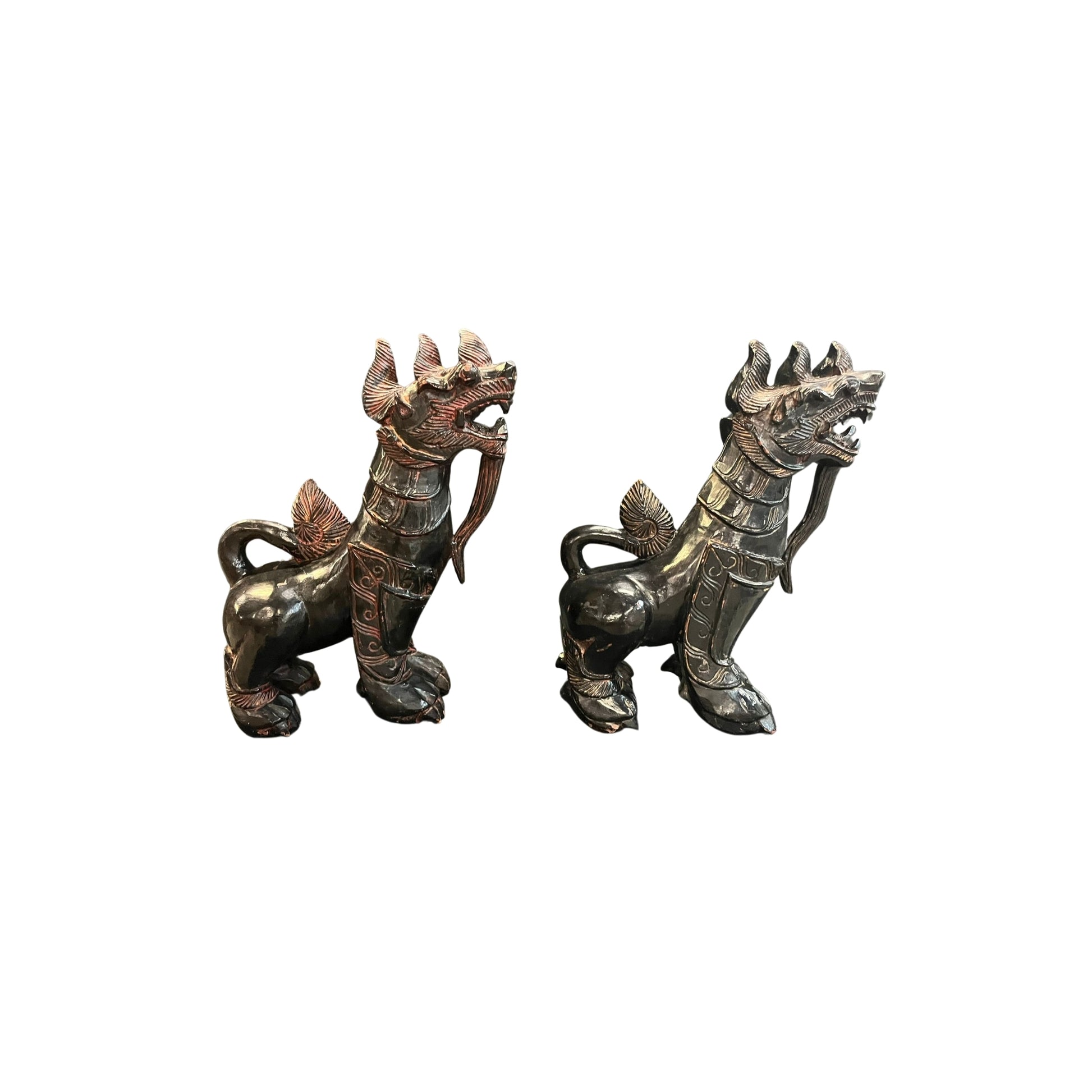 With these antique Chinese wood carved Foo Dogs by your side, you'll never have to worry about evil spirits again! According to Chinese culture, these mythical lions are powerful protectors that bring a sense of safety and peace to your home. Their intricate carvings and sturdy construction only add to their value and beauty. Let these legendary creatures guard your space with their unwavering strength and presence 