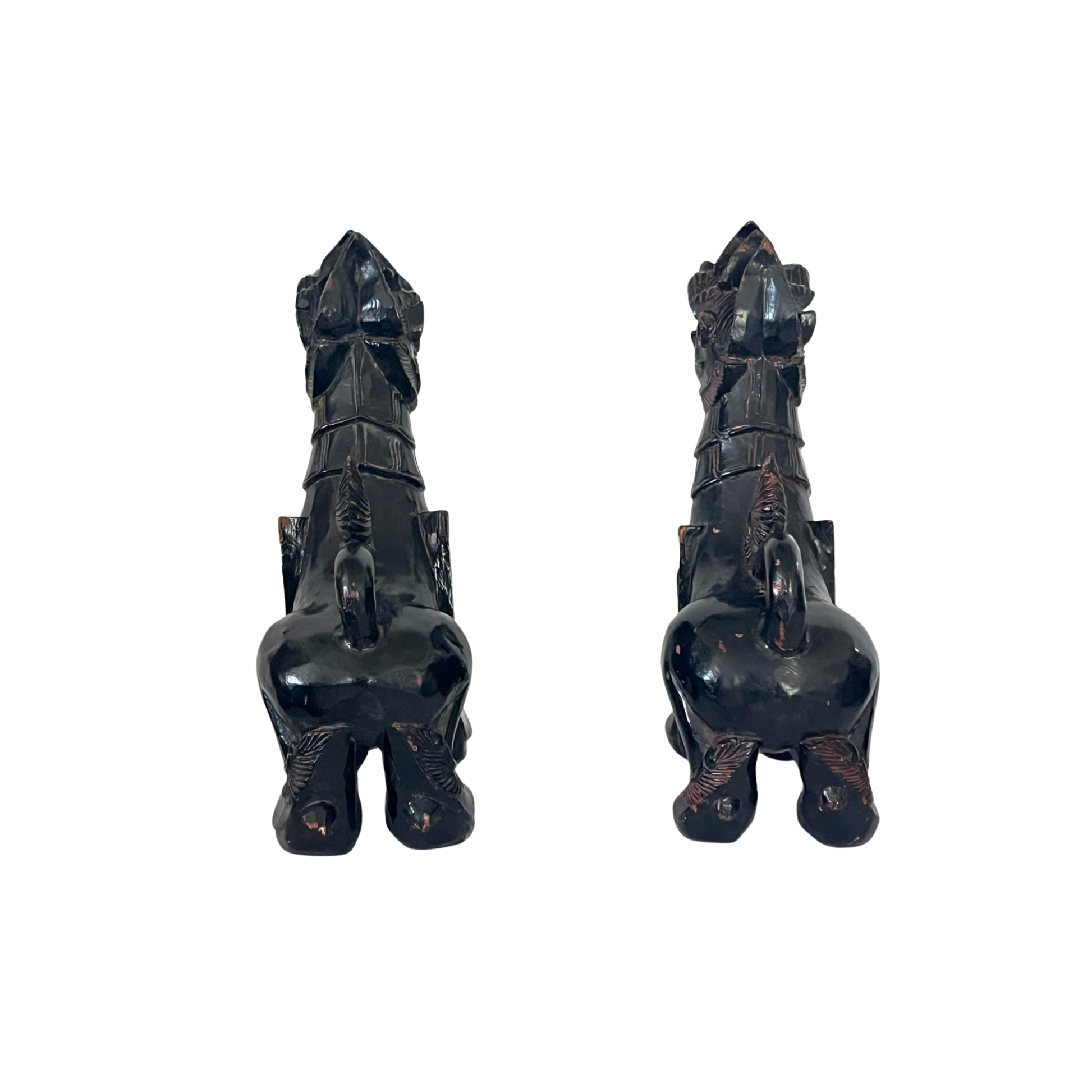 Back view of a pair of old Foo dogs carved in wood