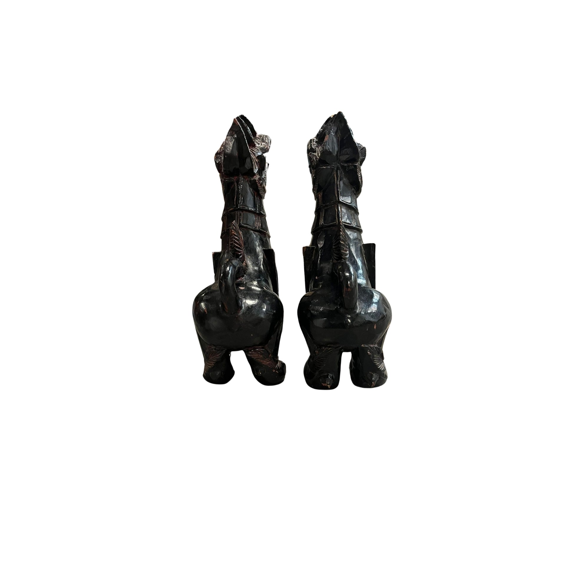 With these antique Chinese wood carved Foo Dogs by your side, you'll never have to worry about evil spirits again! According to Chinese culture, these mythical lions are powerful protectors that bring a sense of safety and peace to your home. Their intricate carvings and sturdy construction only add to their value and beauty. Let these legendary creatures guard your space with their unwavering strength and presence 