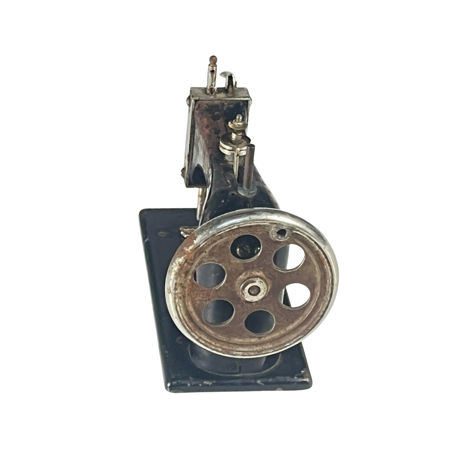 Right view of a vintage sewing machine on a white background