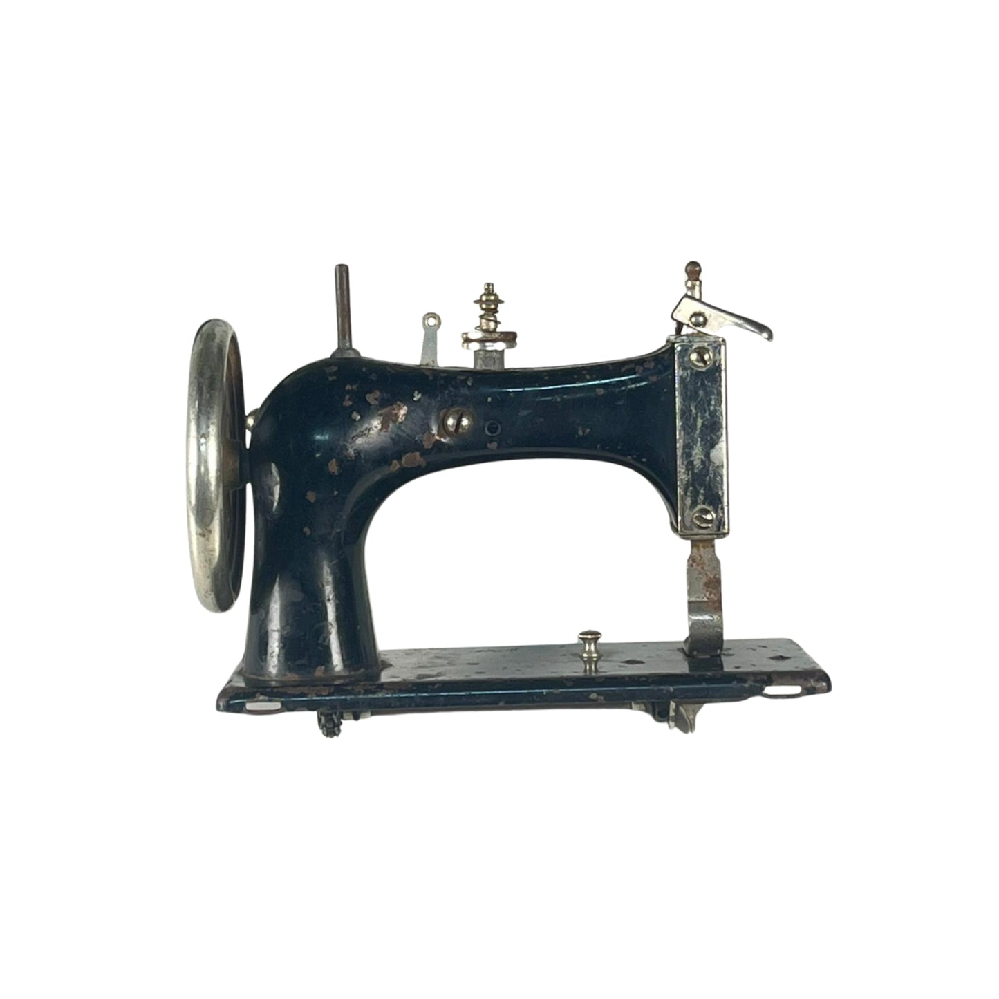 Side view of a vintage sewing machine on a white background