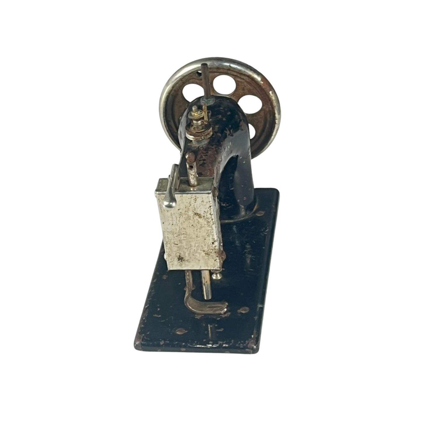 Left view of a vintage sewing machine on a white background