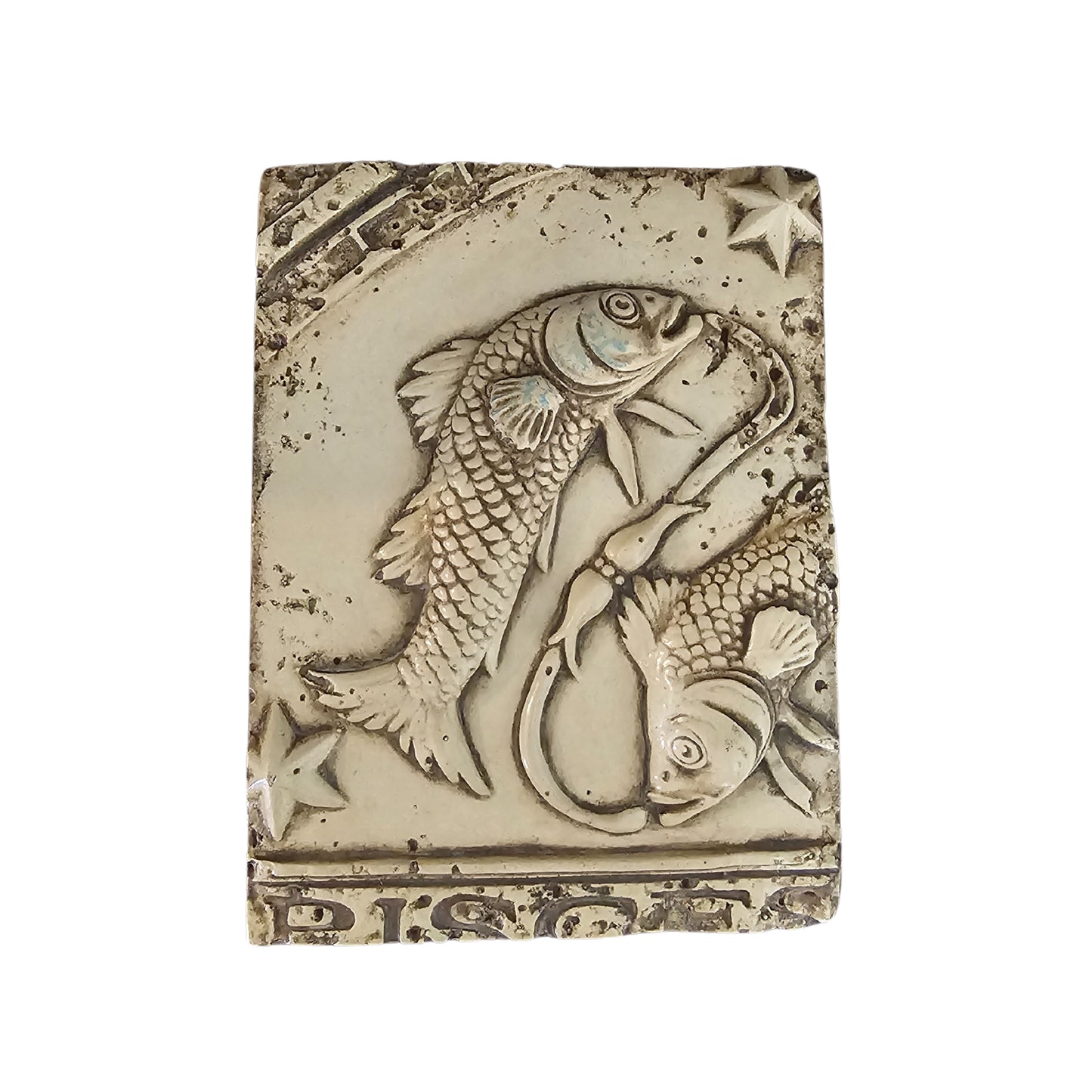 Decorative wall plaque with a fish design on a white background