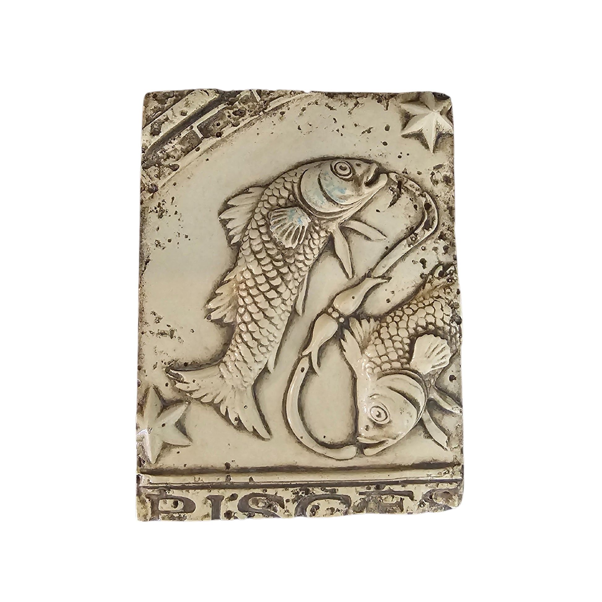 Decorative wall plaque with a fish design on a white background
