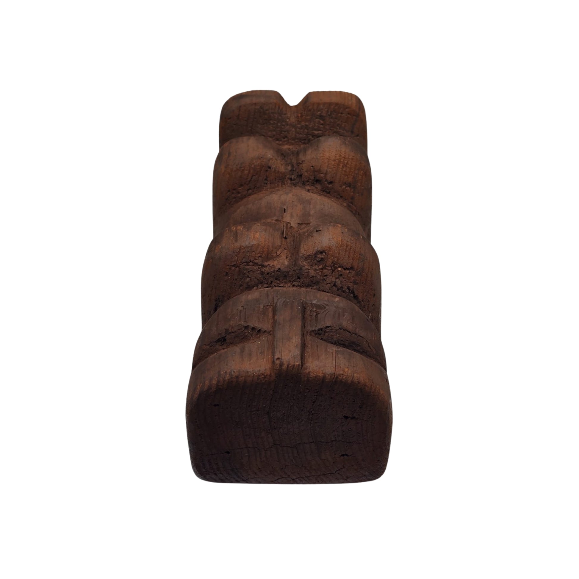 Top view of a Hawaiian wooden tiki sculpture on a white background