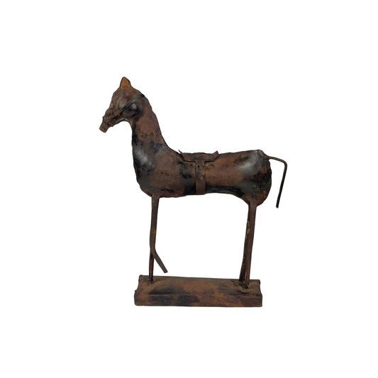 Rustic metal horse sculpture on a white background