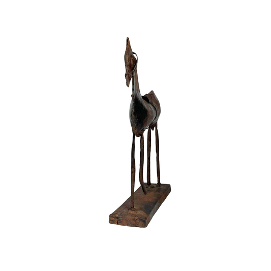 Front view of a rustic metal horse sculpture on a white background