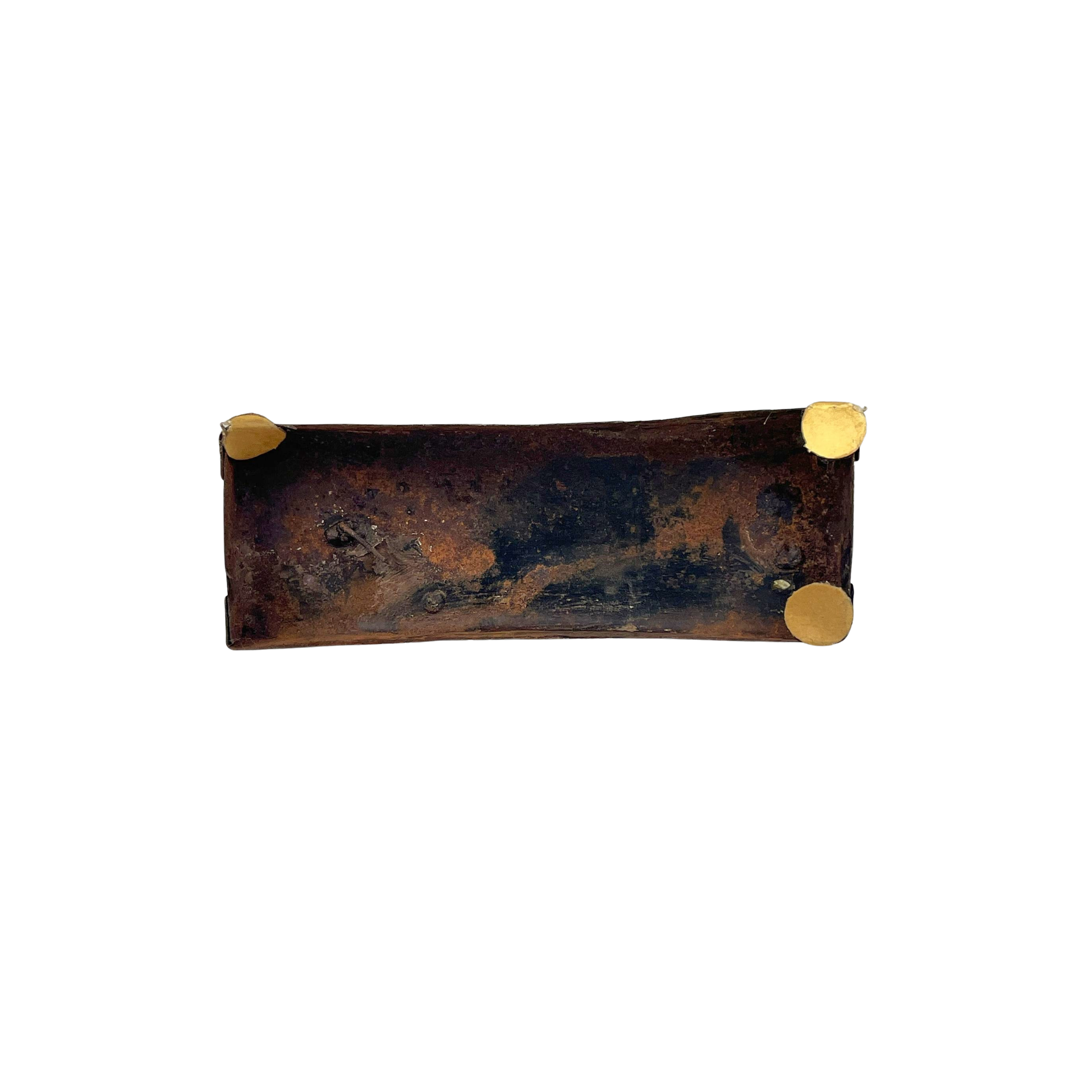 Bottom view of a rustic metal horse sculpture on a white background