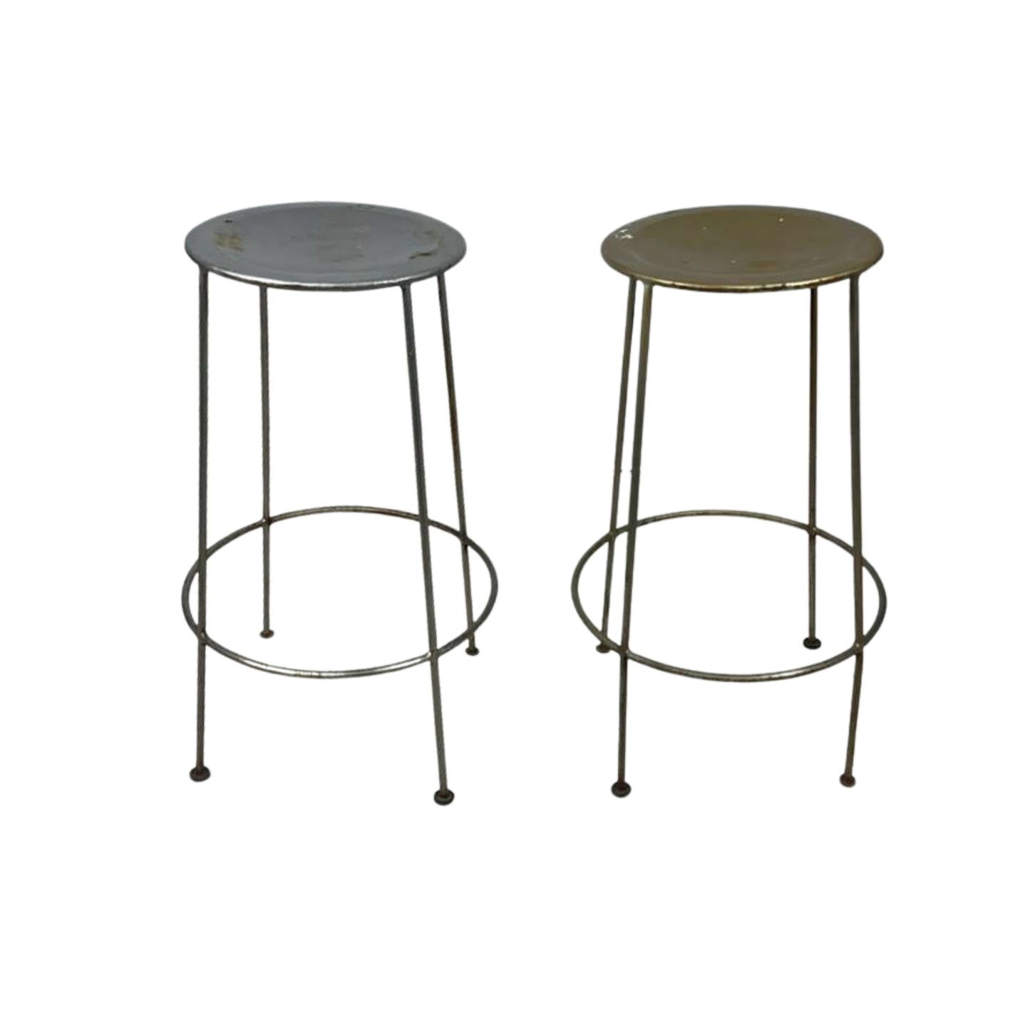 Two metal bar stools with round tops on a white background