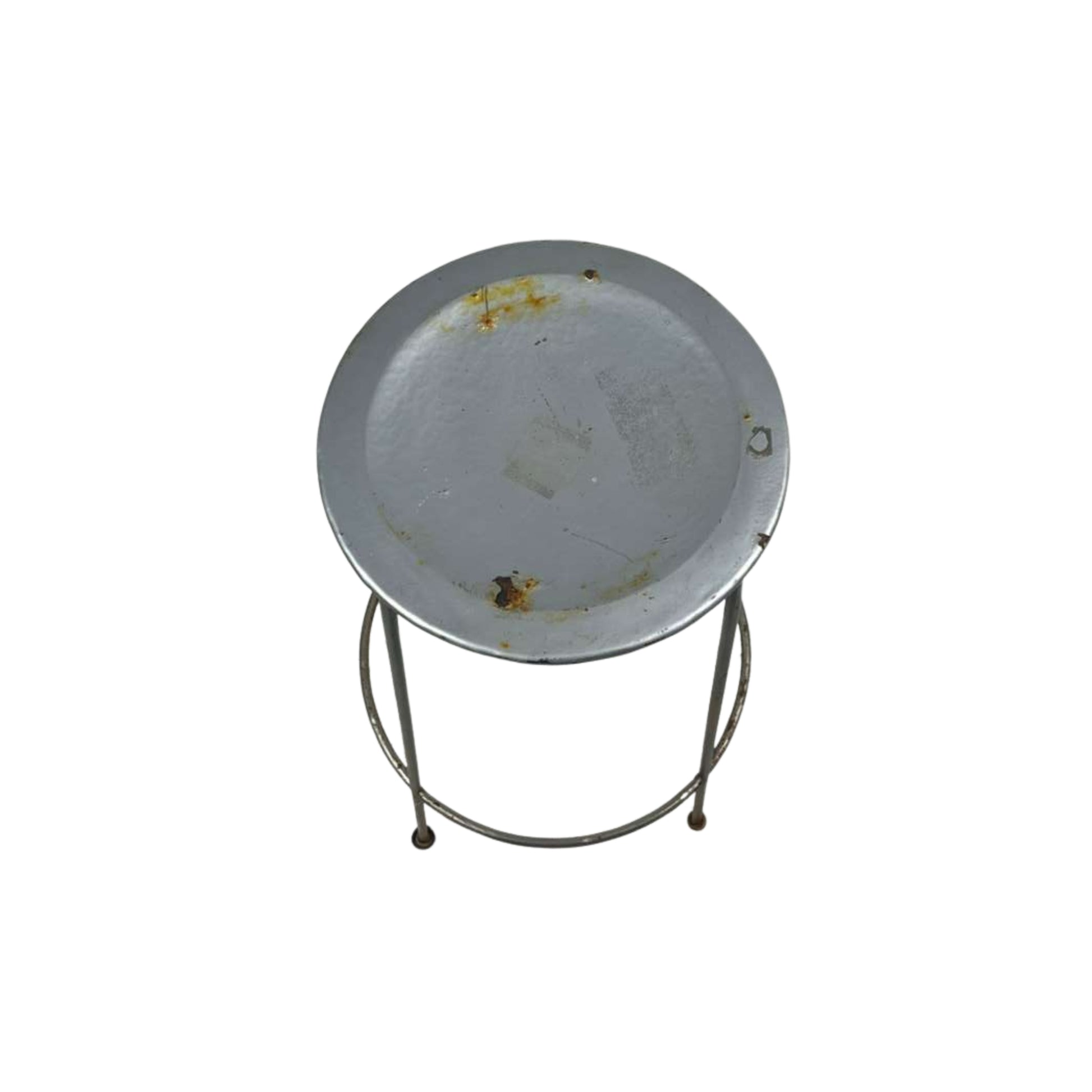 Top view of a metal stool with a round top on a white background