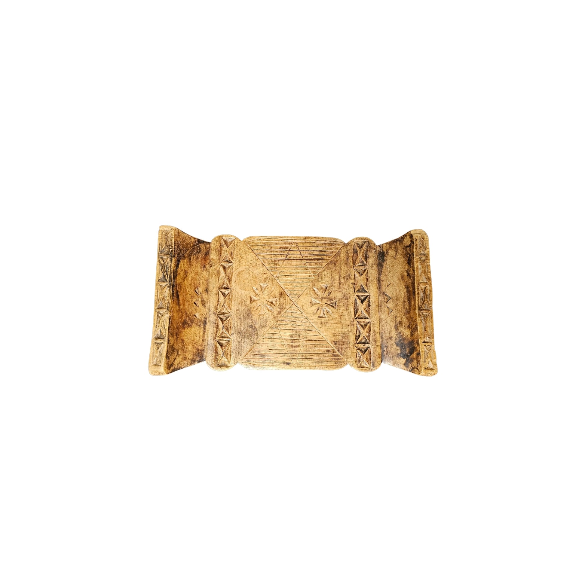 Take a trip back in time with our Vintage Carved Wood Ashanti Stool. This unique piece was crafted in Ghana during the 1950s era and showcases the rich history and culture of the African Ashanti tribe. Every groove and curve on this stool tells a story, making it a perfect addition to any home looking to embrace adventure and take a risk with their decor. Transport your space to a whole new level of boldness and style with this one-of-a-kind piece!