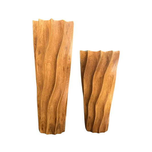 Two wooden art glasses with a wavy design on a white background