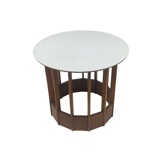 Round side table with wooden base on a white background