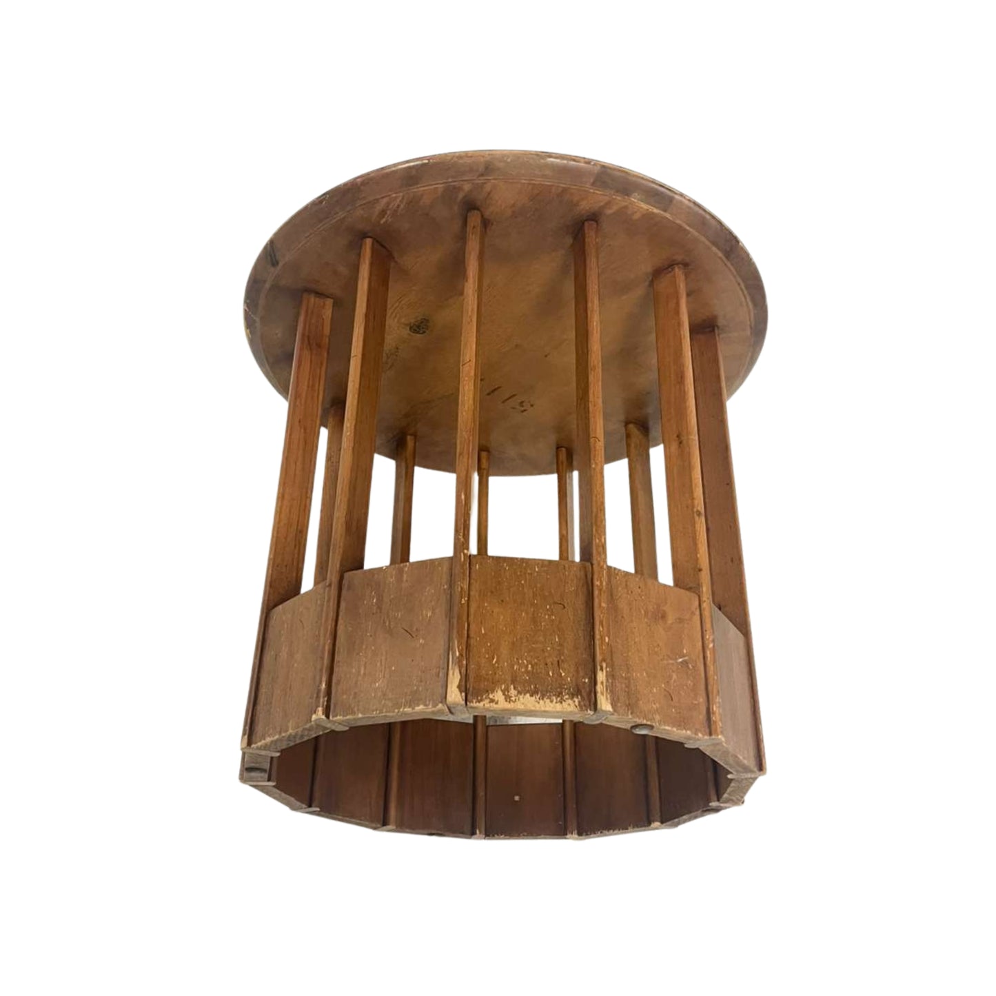 Side view of a rattan side table with a white top on a white background