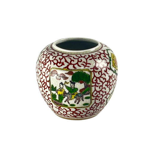 Decorative Japanese ceramic jar with intricate red patterns and a central scene, inspired by the 17th and 18th centuries, on a white background