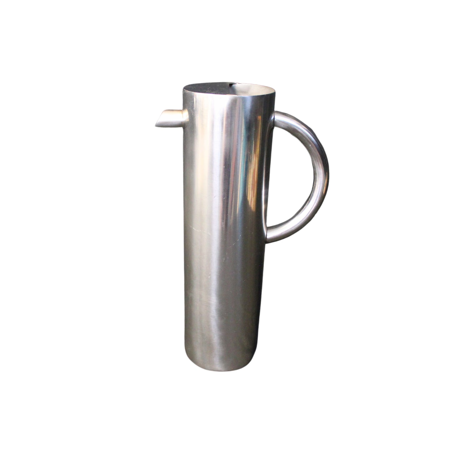 Stainless steel pitcher on a white background