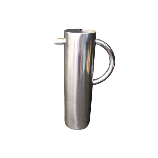Stainless steel pitcher on a white background