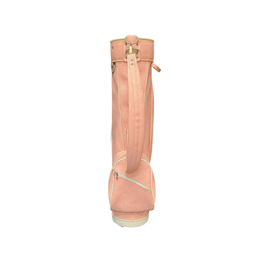 View from the back of a pink golf bag with a strap on a white background