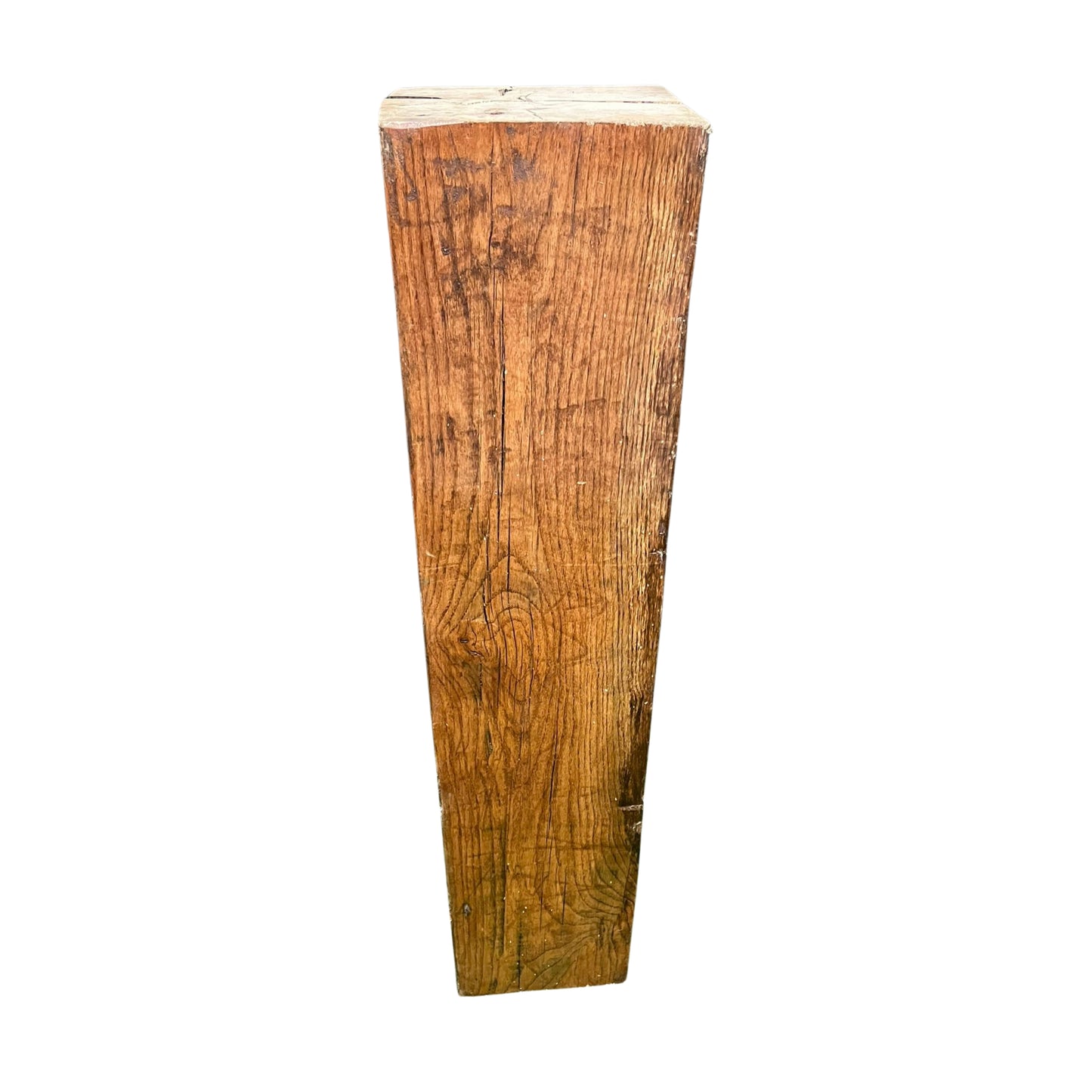 Wooden pedestal with a rough, textured surface on a white background
