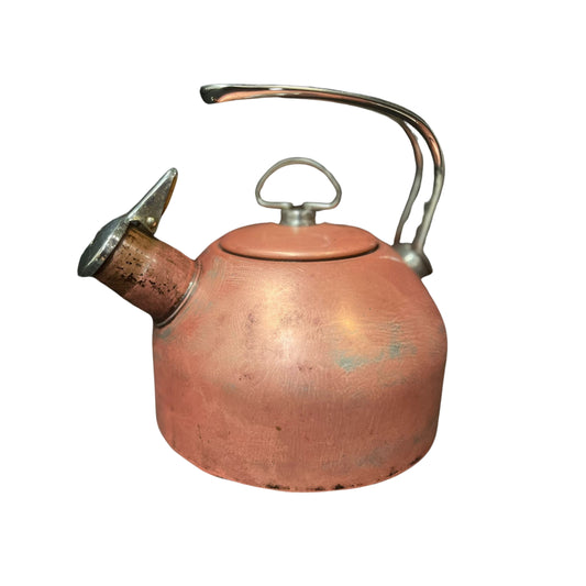 Copper kettle with a silver handle and spout on a white background
