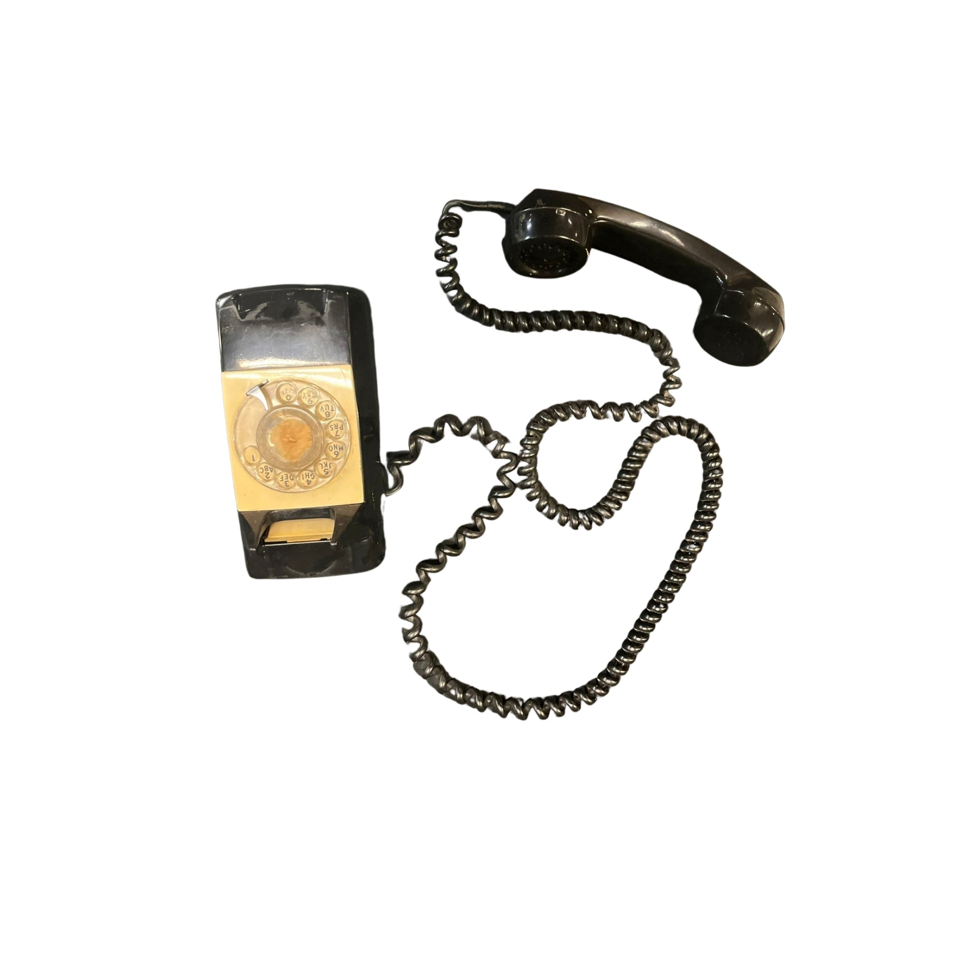 "Get ready to dial back to the past with this funky Vintage MCM Wall Rotary Phone in sleek black. It's a total conversation starter (pun intended), guaranteed to make your friends green with phone envy. Time to get your old school swag on!"