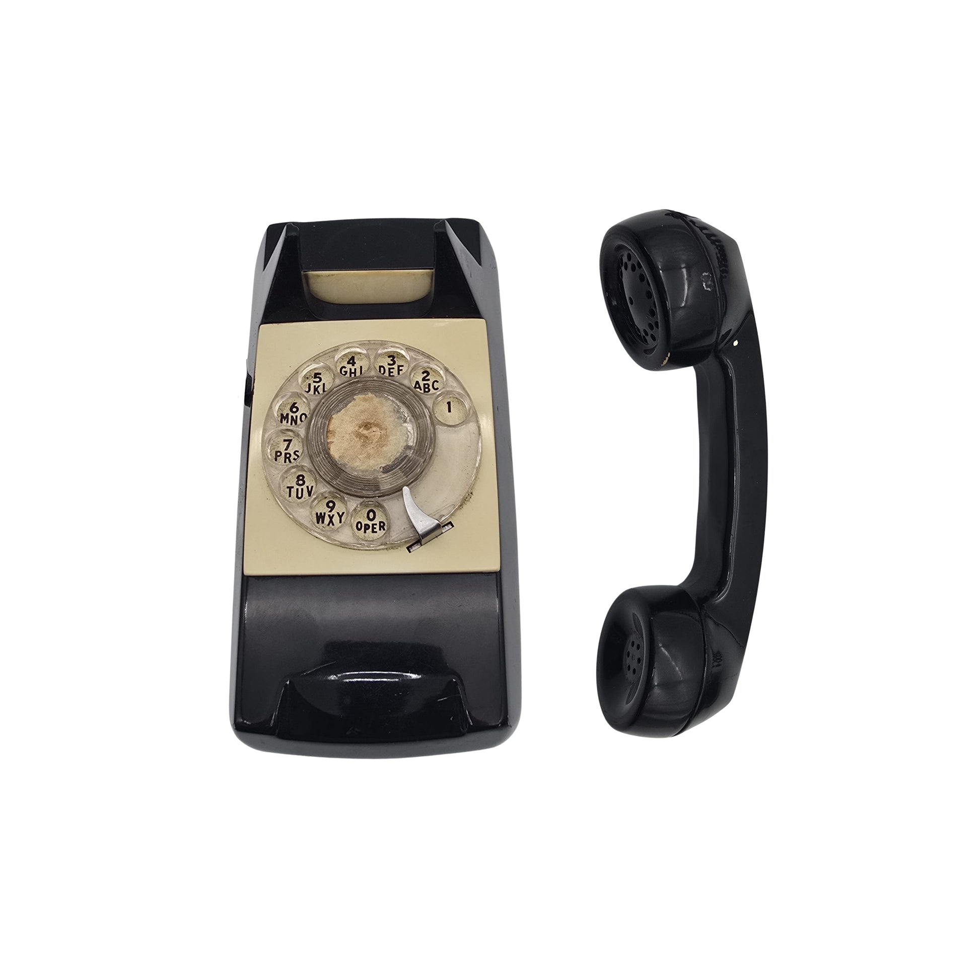Detailed view of both a phone and a vintage black wall-mounted handset with a coiled cord on a white background