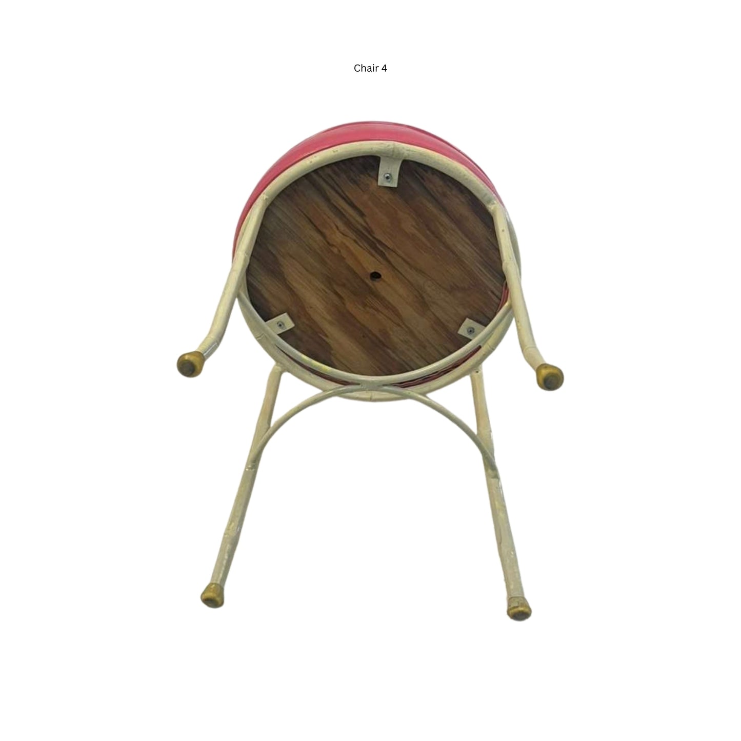 Bottom view of an iron chair with cane and bamboo imitation in pink vegan leather on a white background

