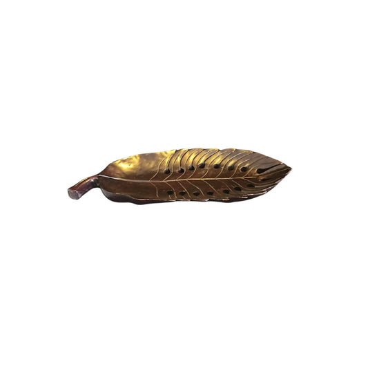 Take a risk and add an organic touch to your home decor with this Philodendron leaf wood carved tray. Made from earthy wood and carved to perfection, this tray is a bold and adventurous addition to any space. Spruce up your home with this unique and natural piece.

Beautifully wood-carved tray in leaf details and mahogany stained, a conversation centerpiece