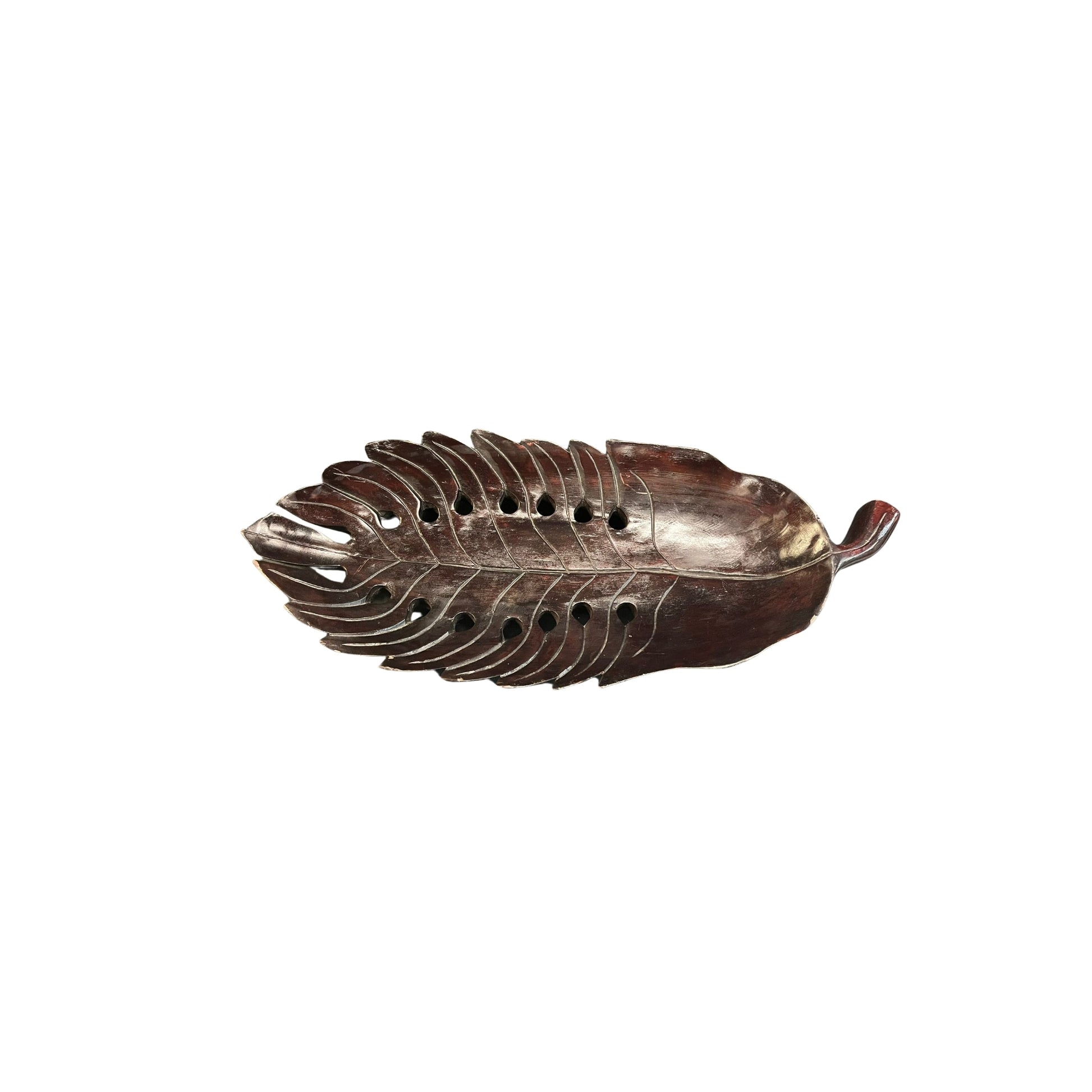 Take a risk and add an organic touch to your home decor with this Philodendron leaf wood carved tray. Made from earthy wood and carved to perfection, this tray is a bold and adventurous addition to any space. Spruce up your home with this unique and natural piece.

Beautifully wood-carved tray in leaf details and mahogany stained, a conversation centerpiece
