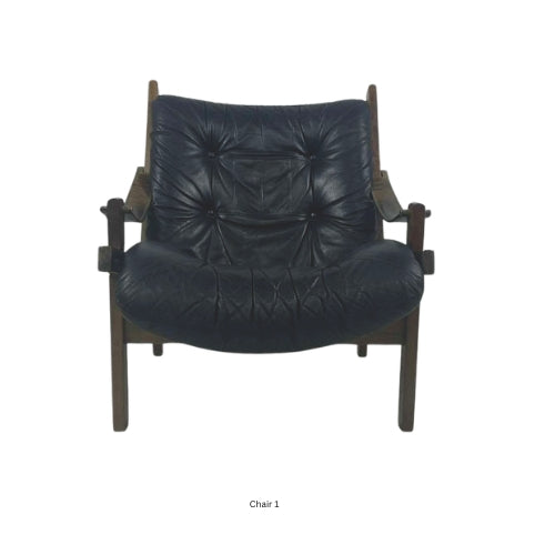 Front view of a vintage mid‑century modern lounge chair with dark tufted leather cushions and a sculpted wooden frame