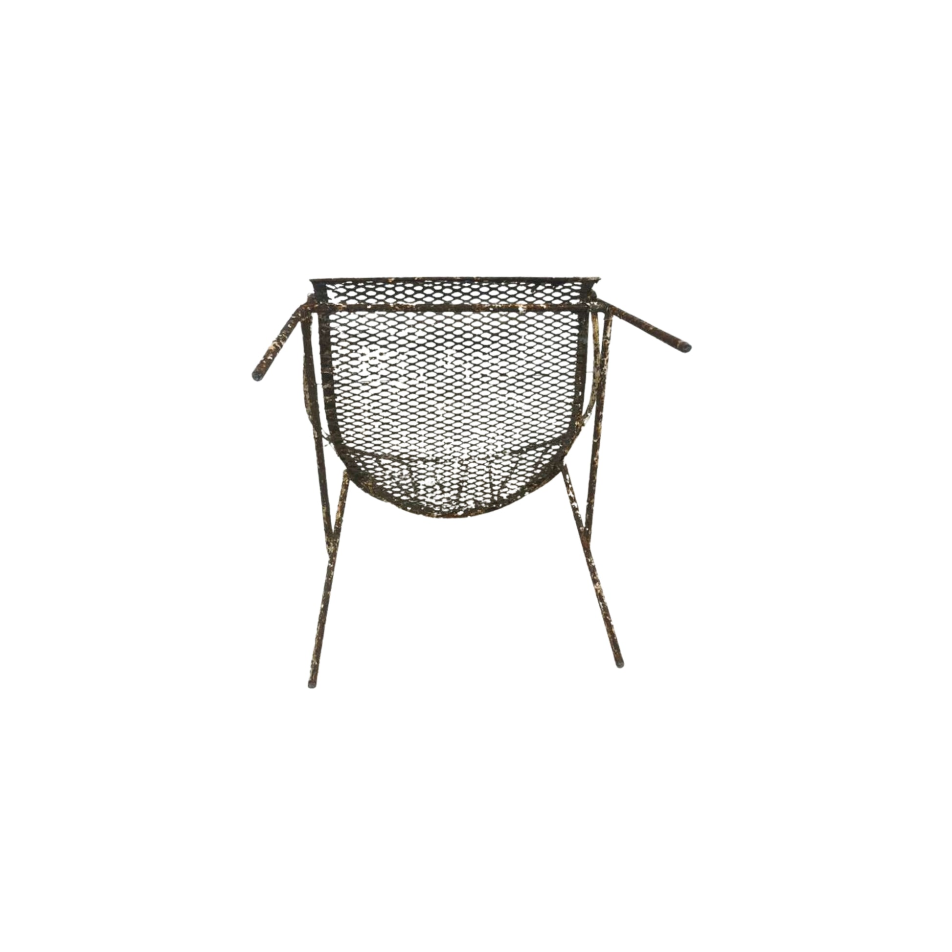 Bottom view of a wrought iron chair on a white background