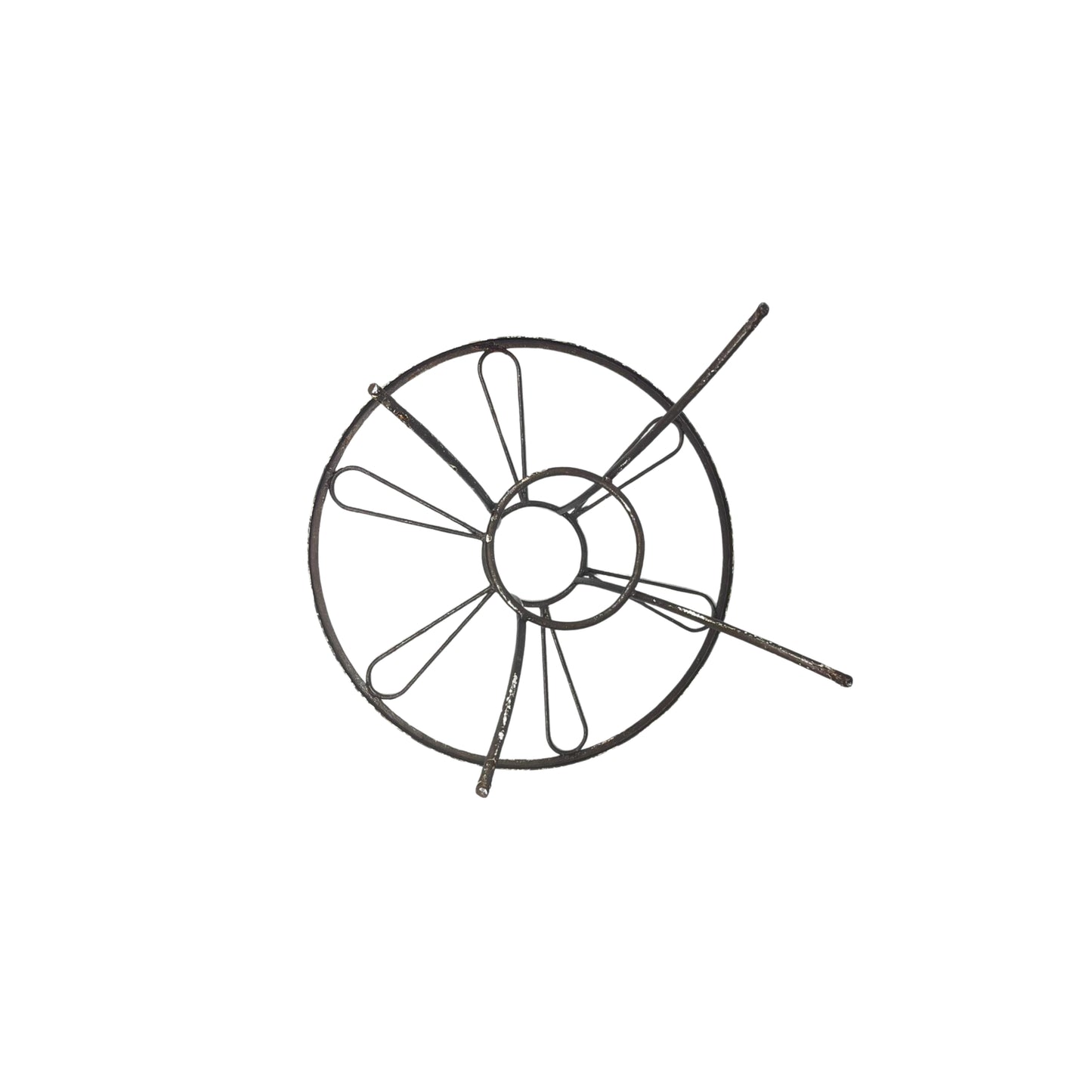 Bottom view of a round wrought iron table without the glass top on a white background