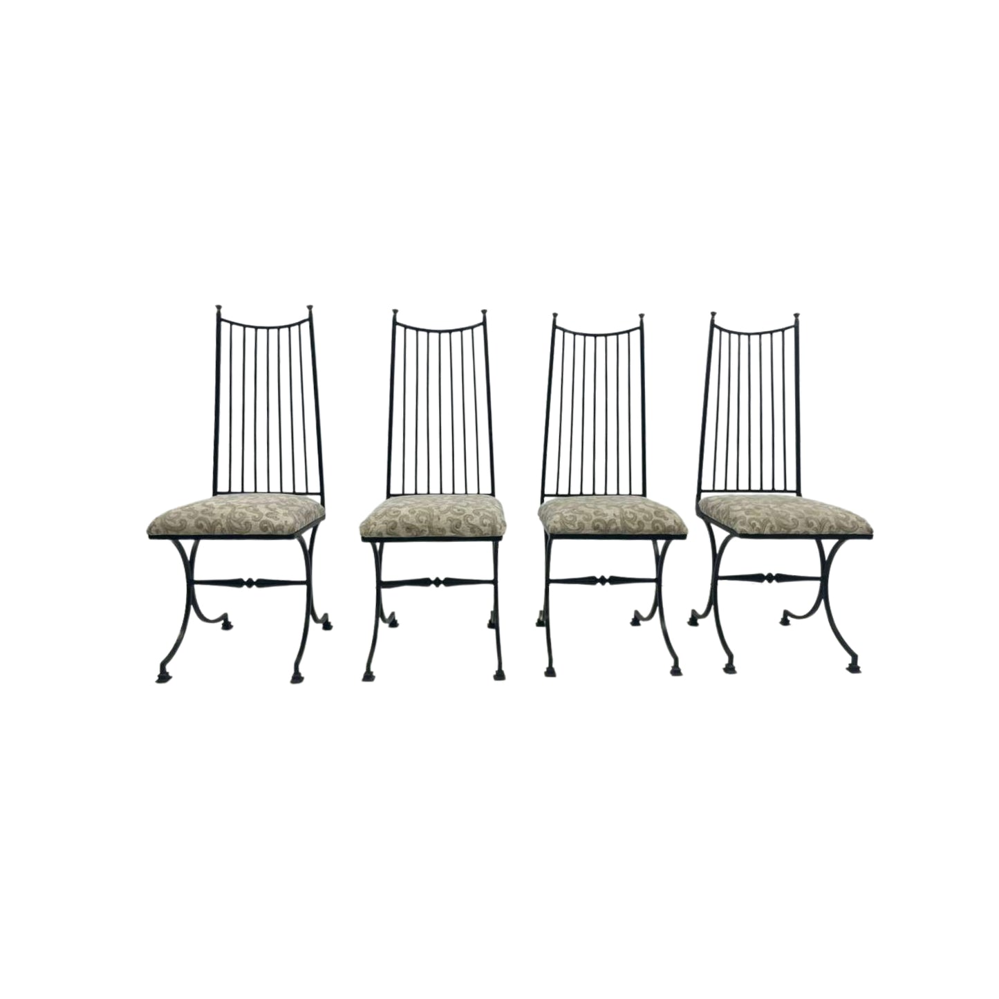 Four black metal chairs with patterned cushions