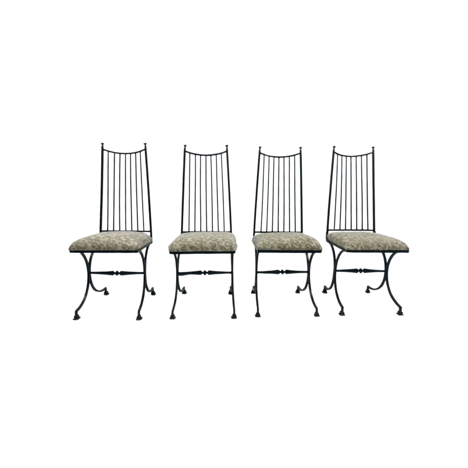 Four black metal chairs with patterned cushions
