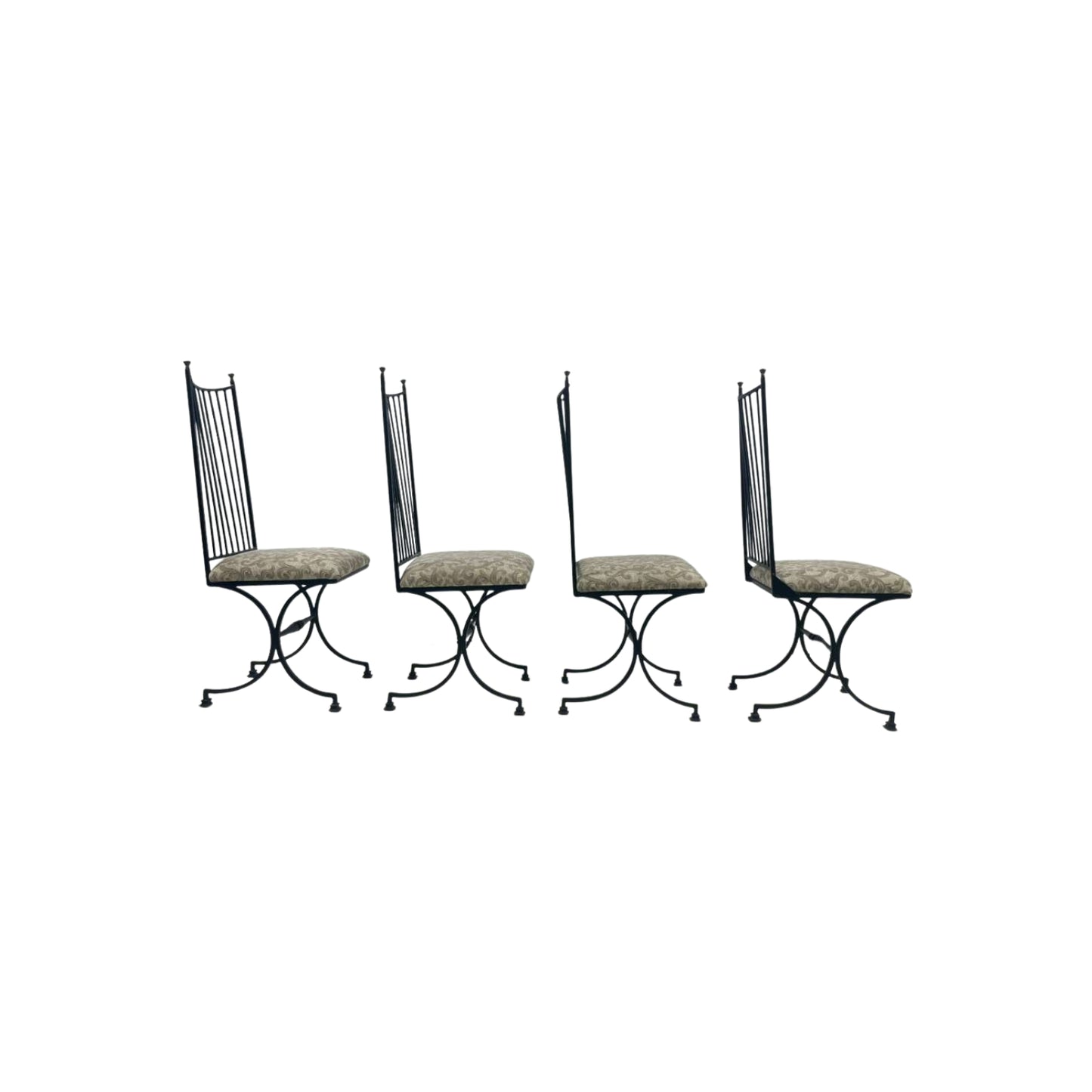 Four black iron chairs with patterned seats